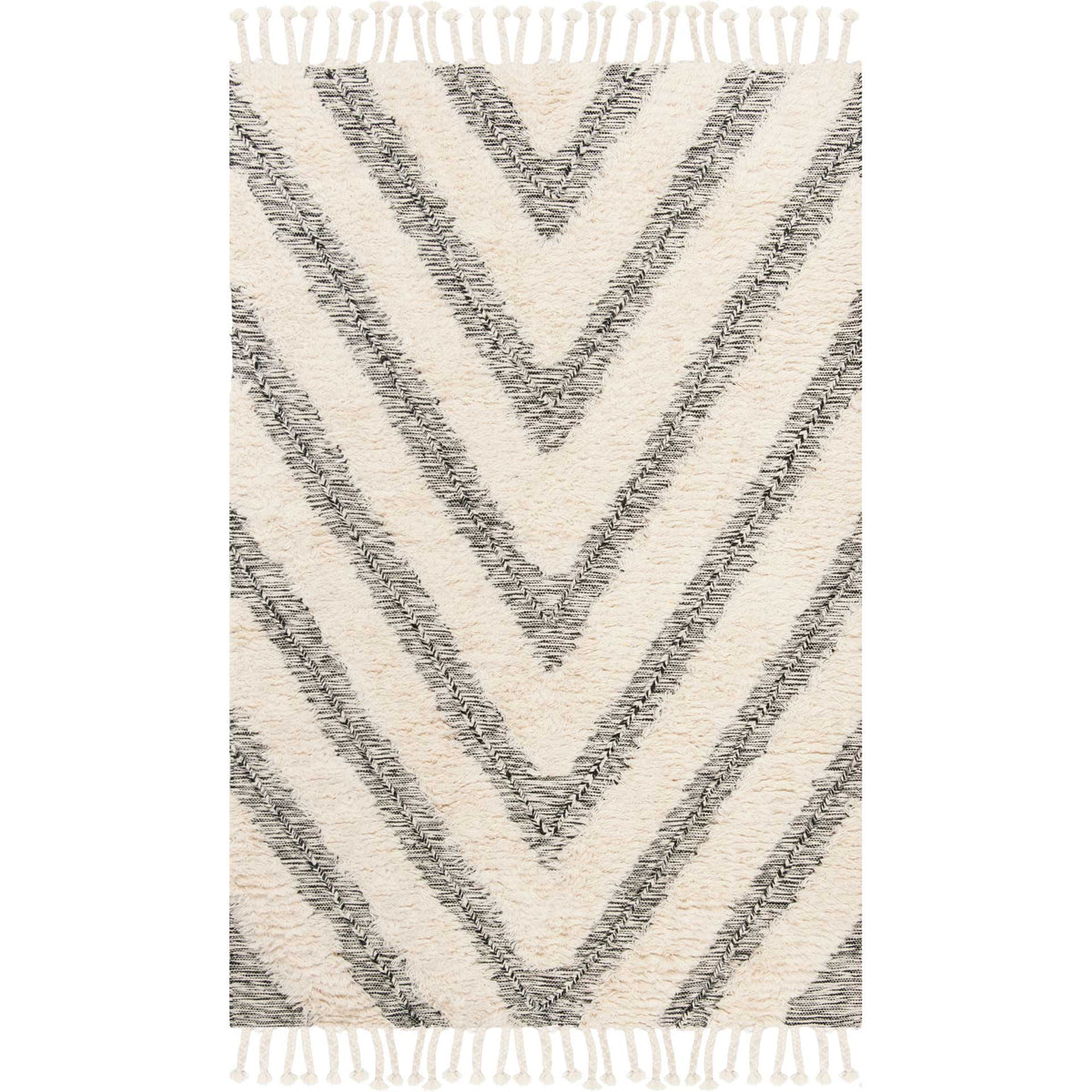 Bold black chevrons cross a fluffy ivory rug finished with tasseled fringe
