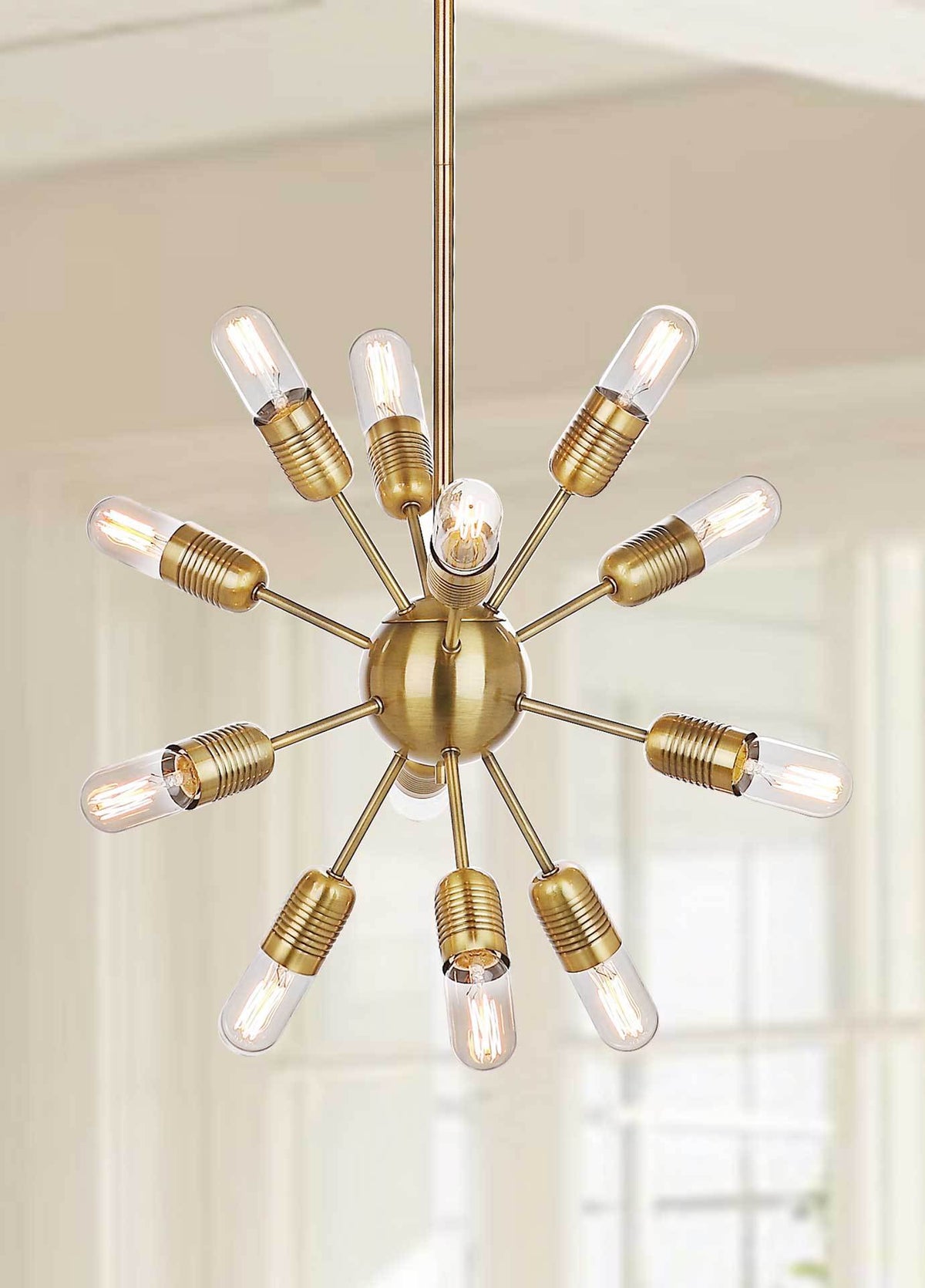 Golden arms and glowing bulbs extend in every direction for a bright, sculptural look.