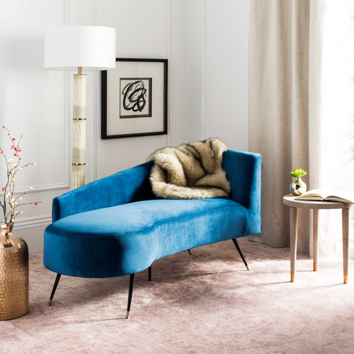 Navy velvet gives this settee's sweeping seat and raised back a bold, inviting presence