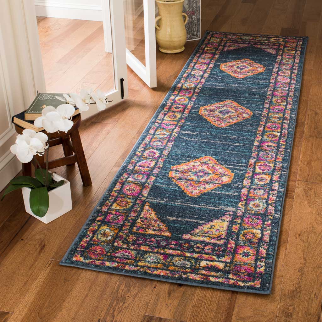 Rich blue runner rug features vivid pink and orange motifs within an ornate border