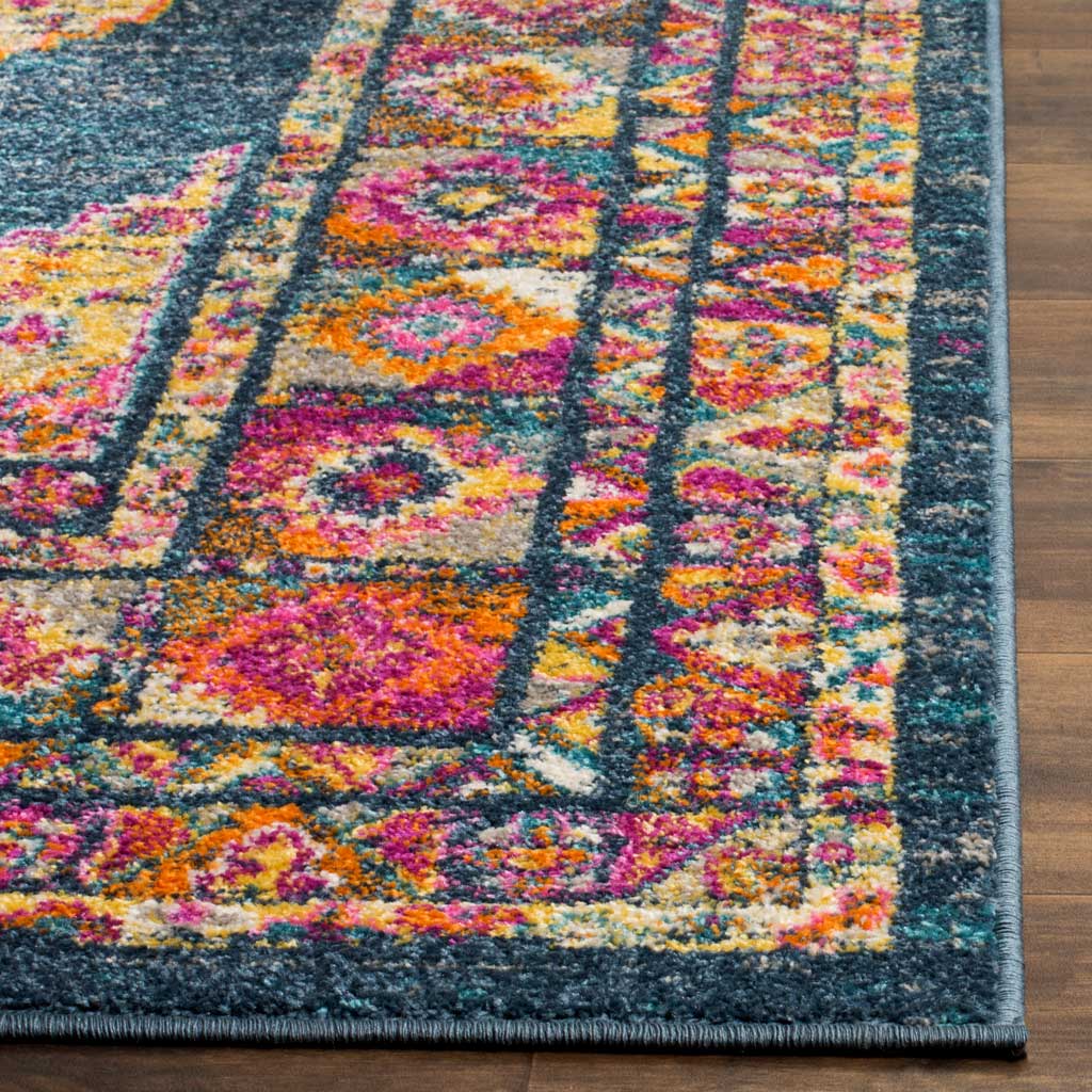 Multicolored floral motifs meet a deep blue field and a neatly bound edge