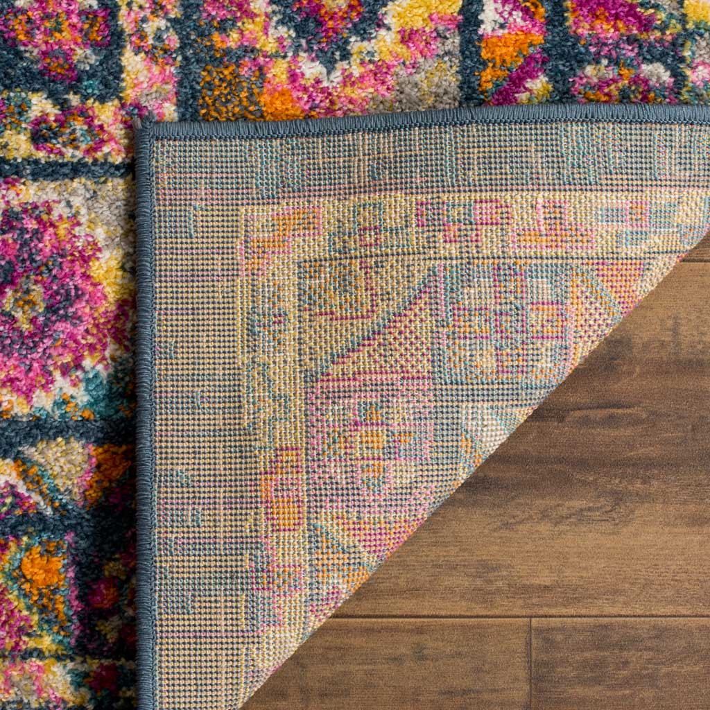 A bound blue edge and textured woven underside complement the vibrant patterned pile