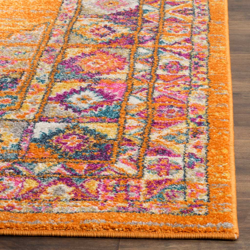 Orange pile, jewel-toned floral motifs, and a neat bound edge bring texture to the border