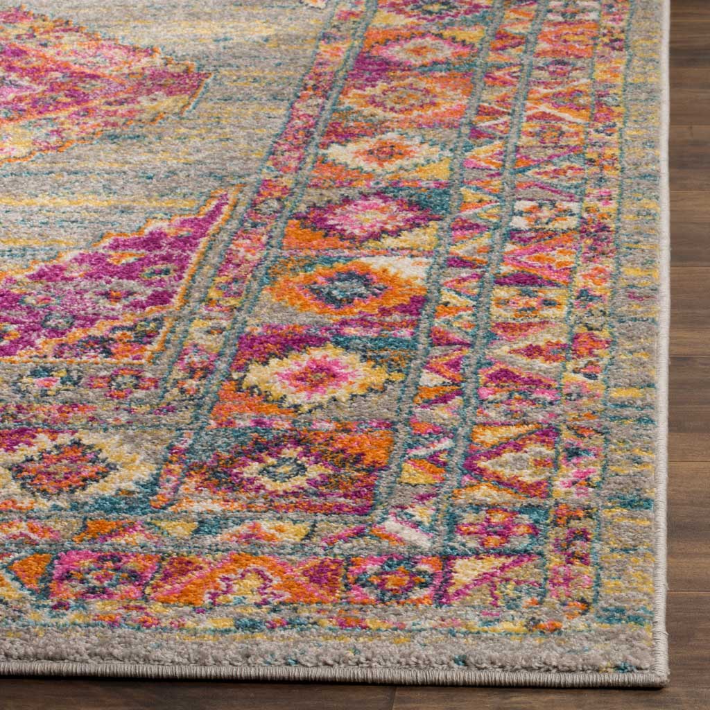 Fuchsia and orange floral motifs enliven the rug's light gray field and bound edge