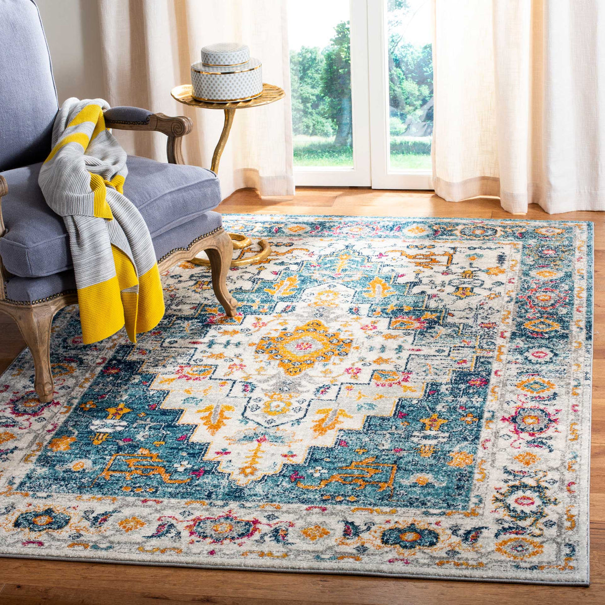 Turquoise and ivory rug with an orange medallion and richly layered traditional motifs