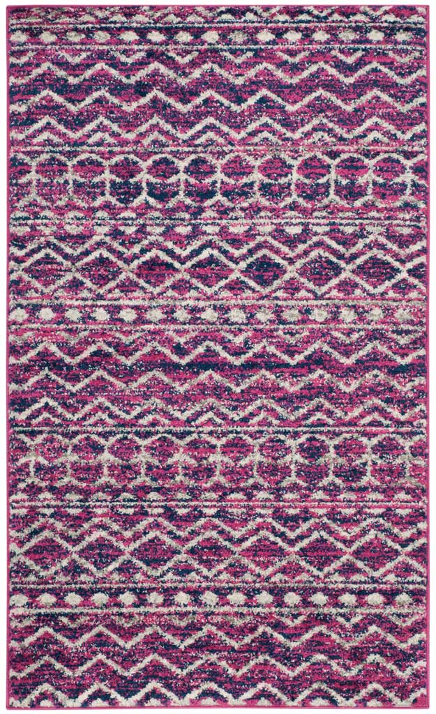 Bold navy chevrons and fuchsia diamond rows give this rectangular rug a vibrant look