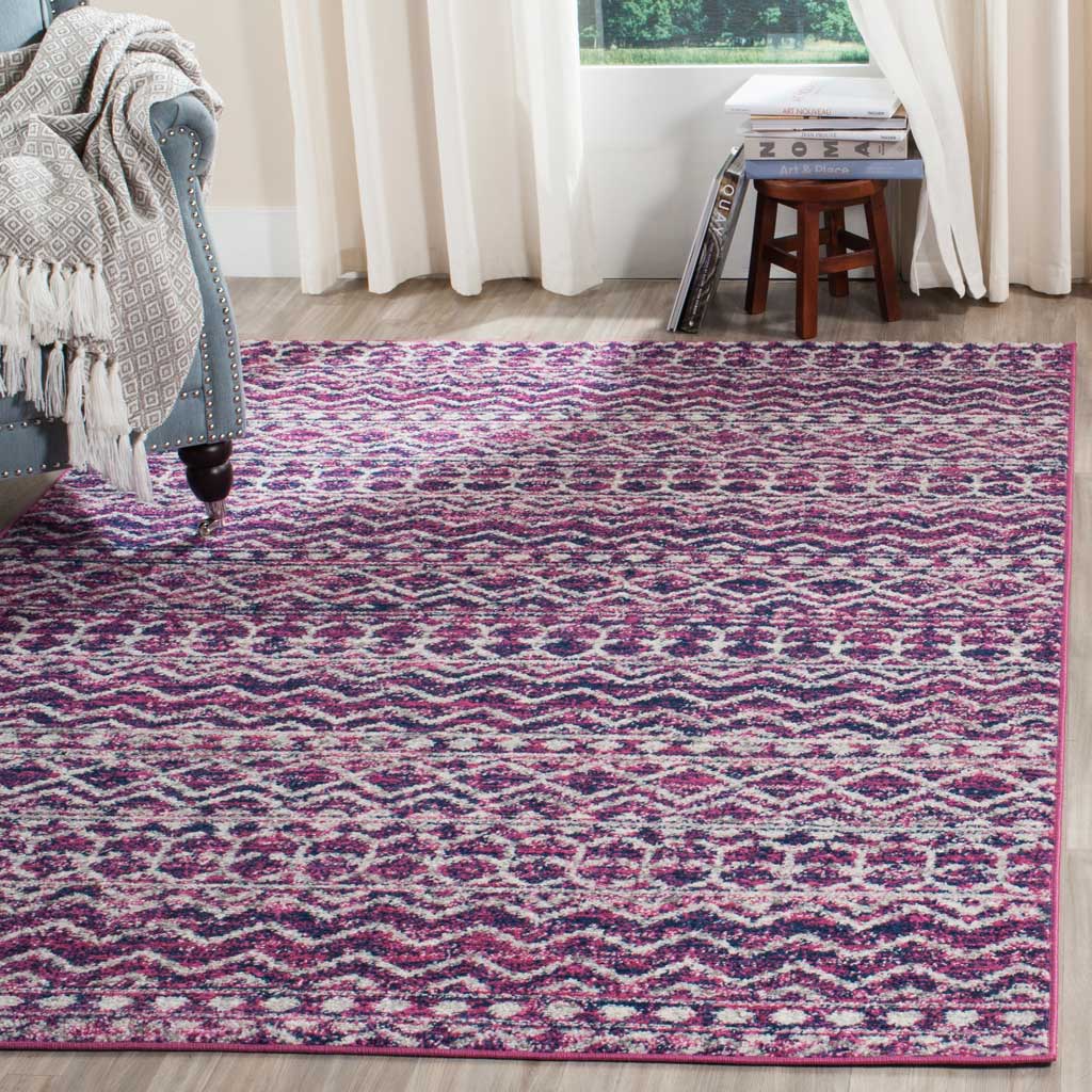 Vivid fuchsia and navy geometric bands add energy to a cozy living space