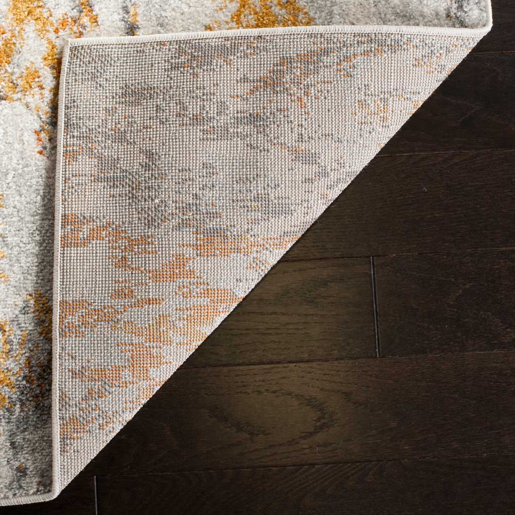 A folded rug corner reveals woven backing and neatly bound edges