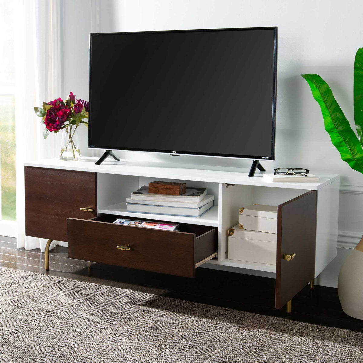 A walnut drawer and cabinet door open to reveal room for accessories beside the bright white shelf.