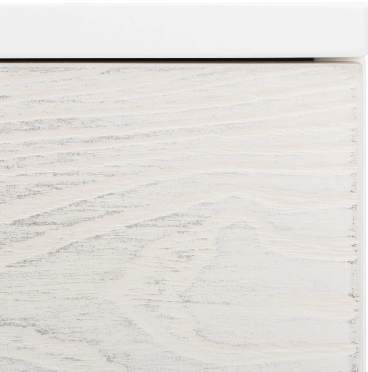 Delicate gray grain peeks through the whitewashed door beneath the crisp white tabletop.