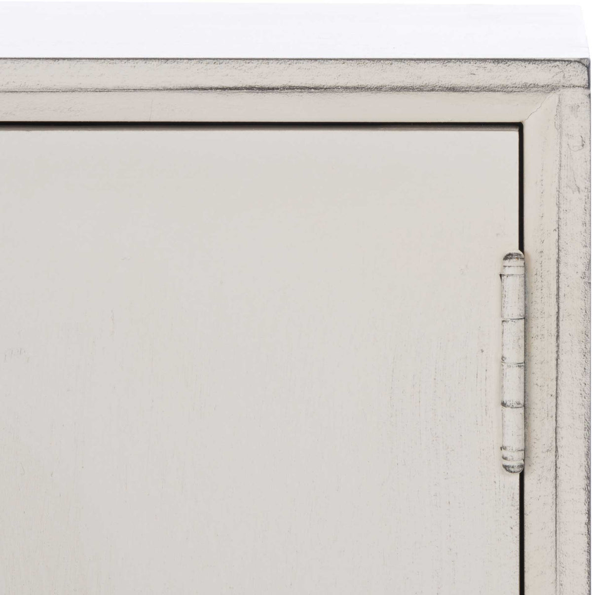 Weathered dark edges and a pale hinge highlight the white cabinet's distressed finish.