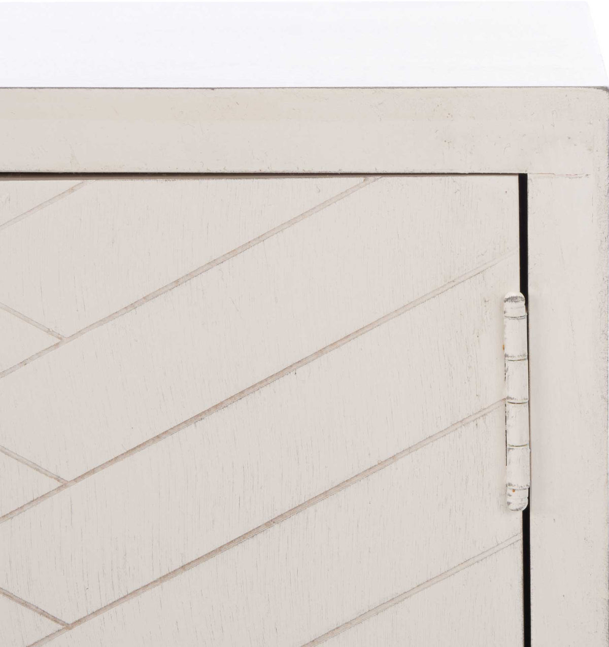 Light distressing accents the white door's chevron grooves and exposed metal hinge.