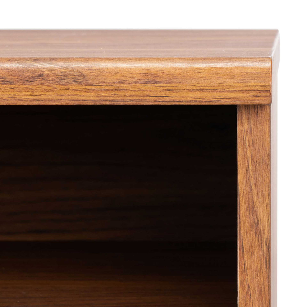 A rounded top edge and wood-grain finish frame the media stand's open storage space.