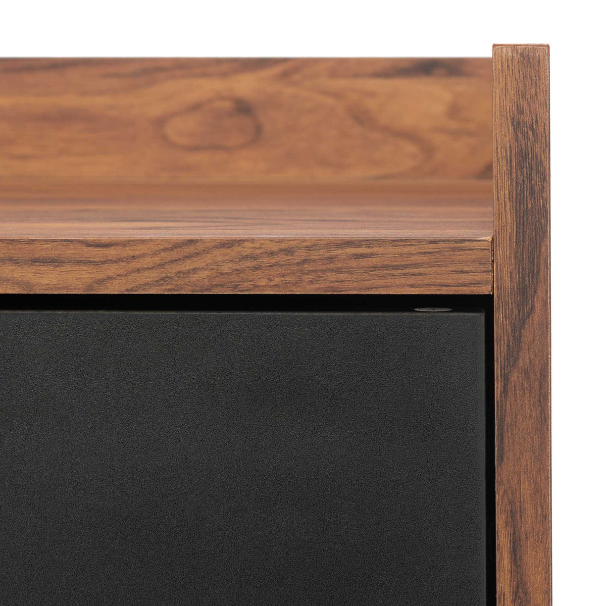 Warm wood grain frames a smooth black door beneath the stand's raised top edge
