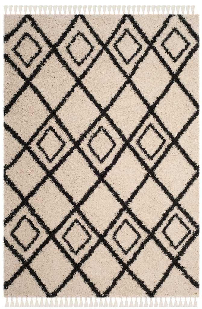 Cream shag rug with a dark diamond lattice and knotted ivory tassels
