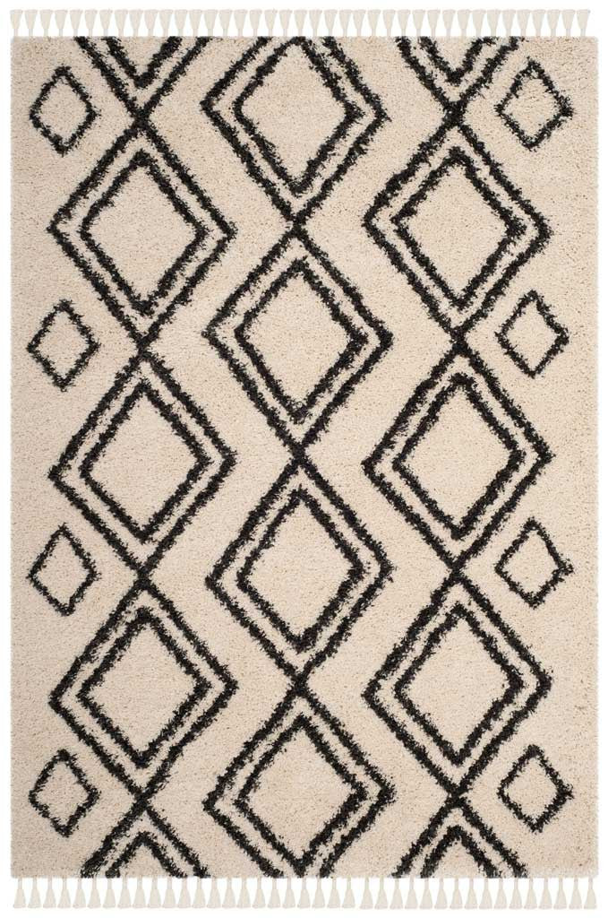 Nested charcoal diamonds form a lively repeat across this tasseled cream rug