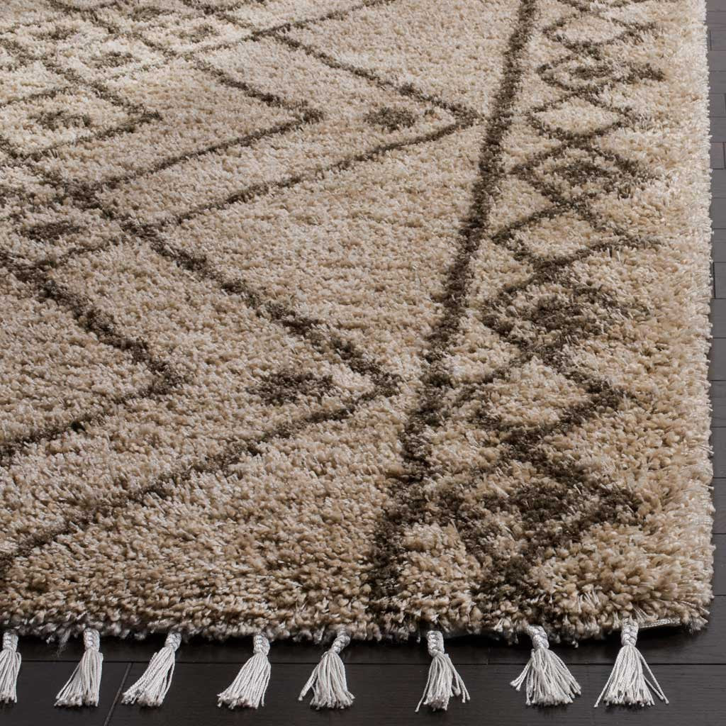 Plush mushroom pile, slim gray lines, and cream tassels add inviting texture