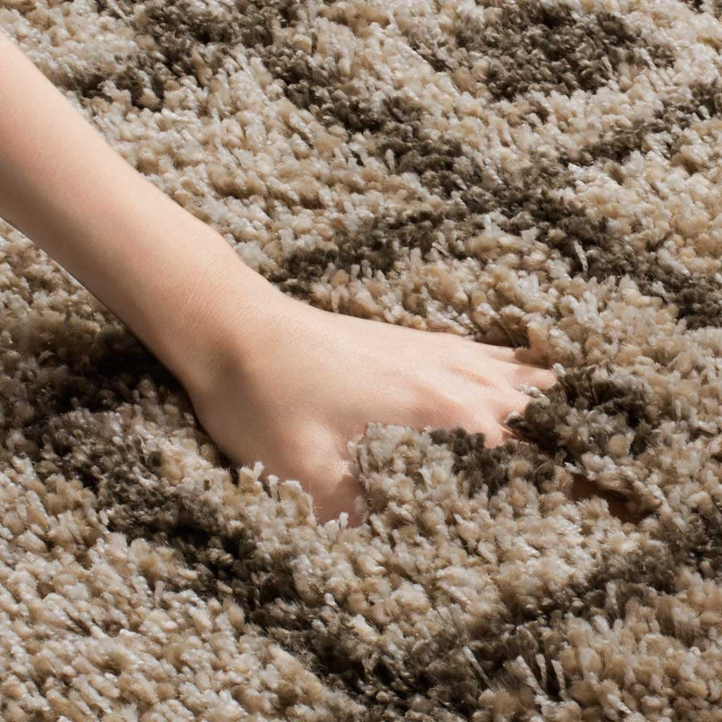 Deep mushroom and gray pile feels soft and springy beneath a hand