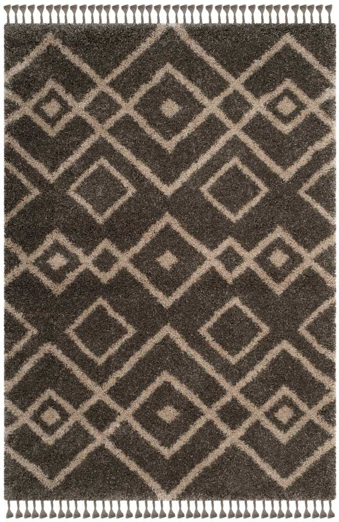 Cream geometric diamonds enliven a plush gray rug with tasseled edges