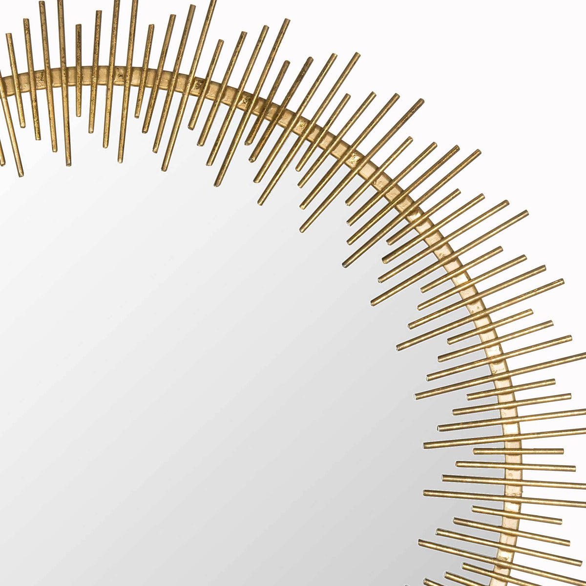 Varied-length iron rays bring texture to the antique gold frame.