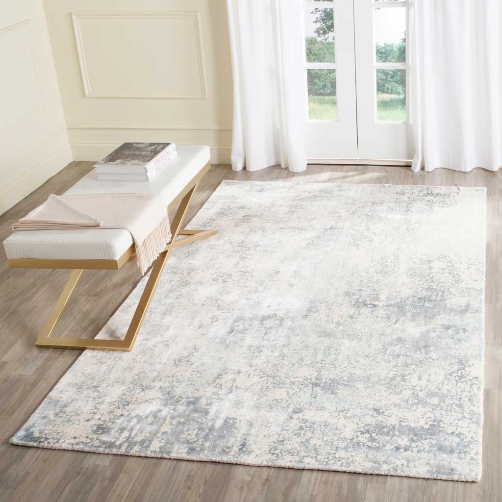 Hints of aqua and soft gray give this ivory rug a light, serene feel