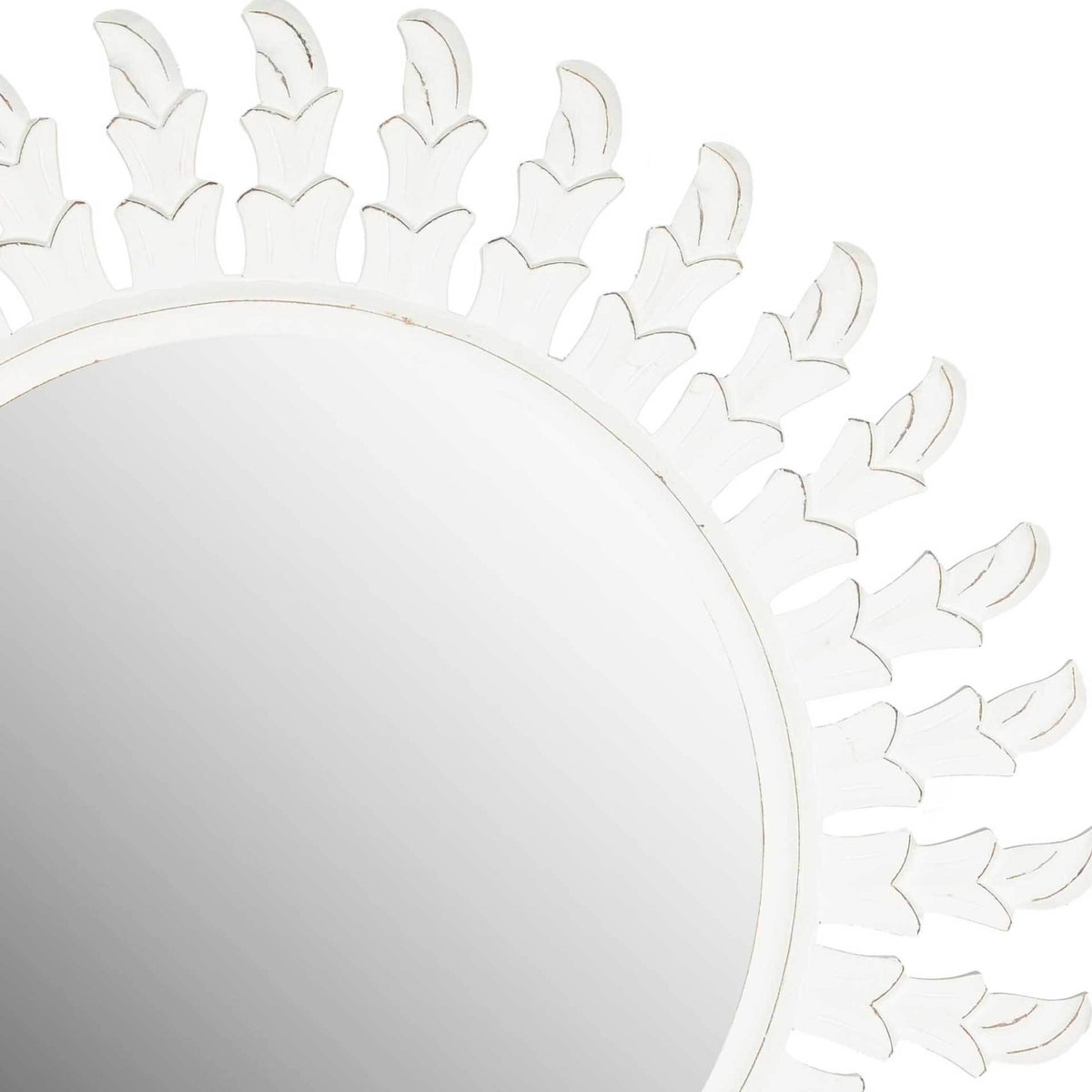 Subtly distressed edges trace the sculpted white leaves around the mirror's rim.
