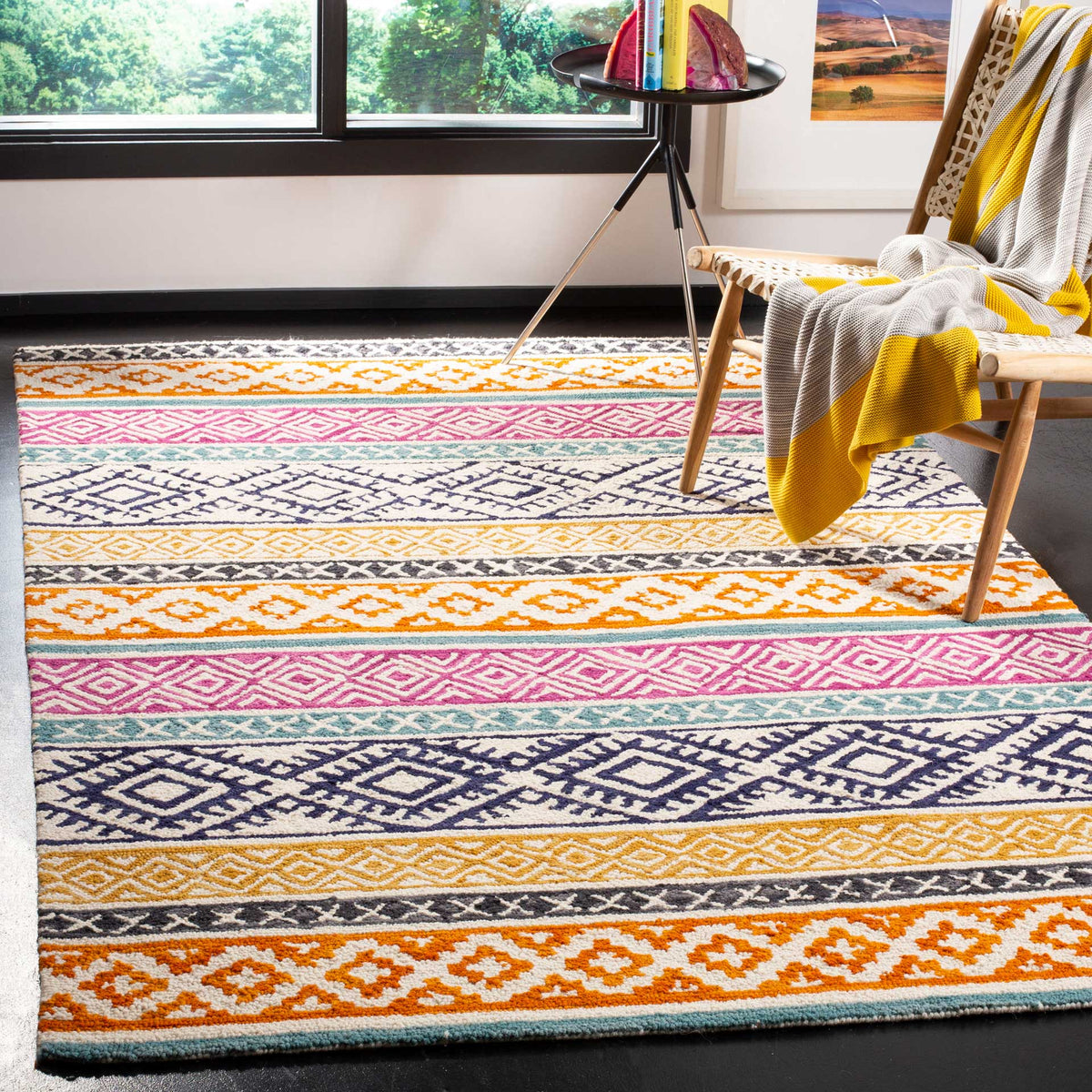 Bright orange, pink and navy geometric stripes lend playful color to this ivory rug