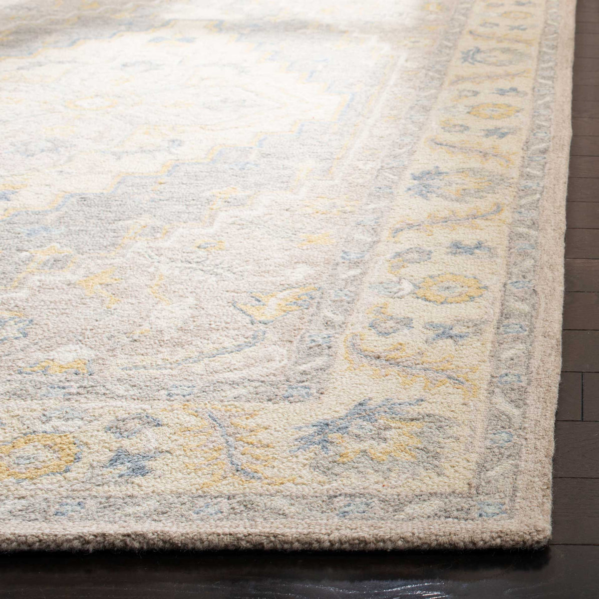 Soft wool pile and delicate blue and gold flowers enrich the rug's bordered corner.