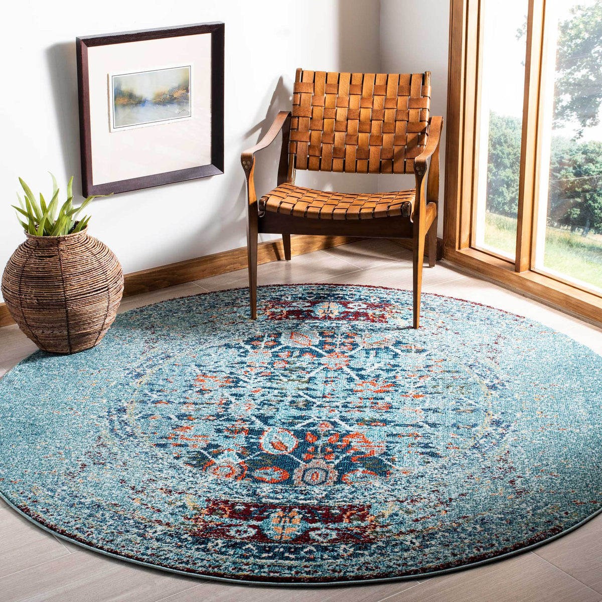 A round blue rug brightens the room with an ornate medallion and multicolored accents