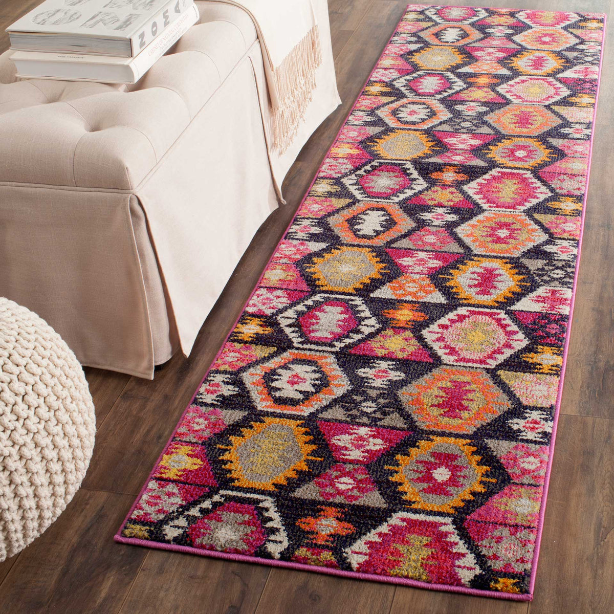 A colorful geometric runner adds lively pattern beside neutral furnishings