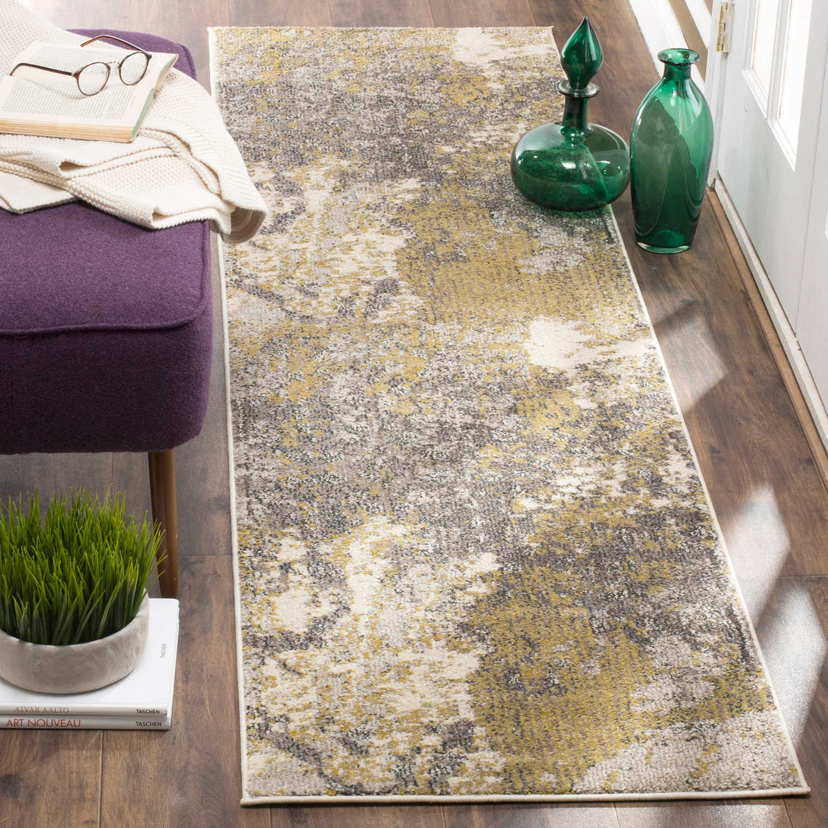 Mottled ivory, gray, and gold runner rug brings modern texture to a narrow living space