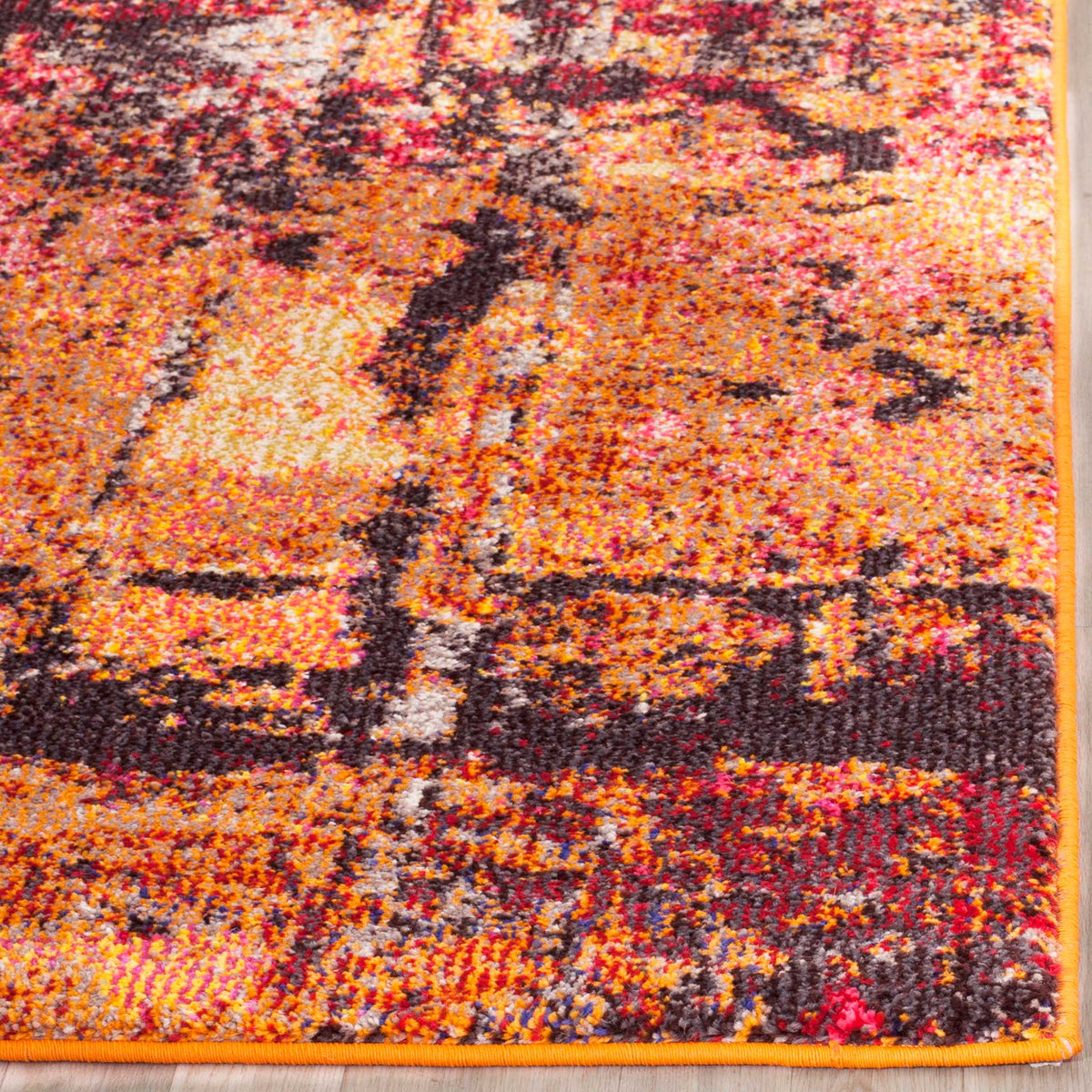 A vibrant orange bound edge frames dense orange, pink and charcoal markings.
