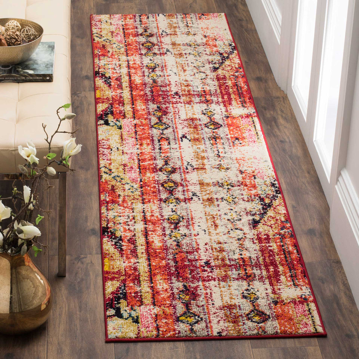 Vibrant magenta runner rug brings a vintage-inspired mix of red, gold, and blue to narrow spaces.