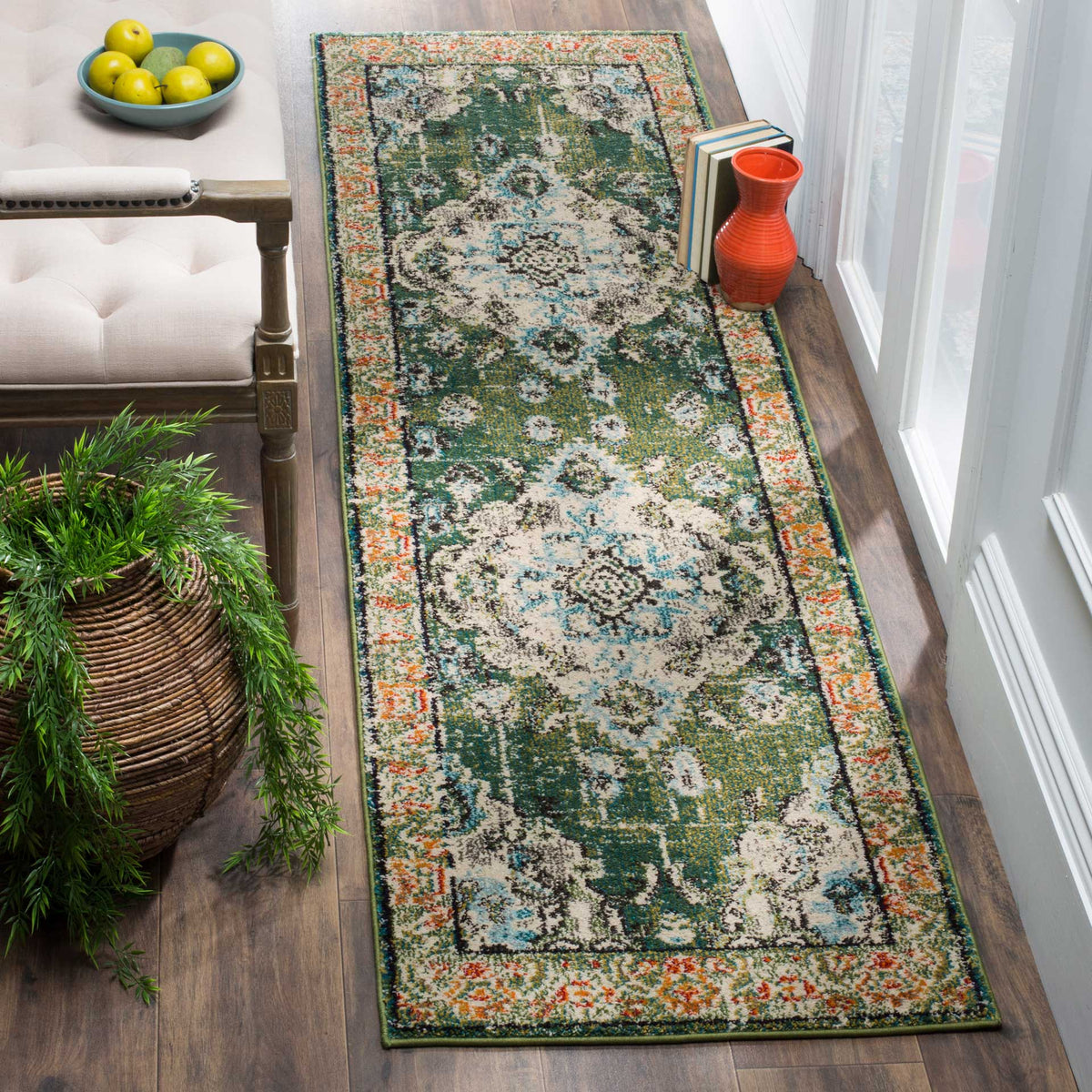 Forest green and light blue runner brings vintage-inspired pattern to a wood-floored hallway
