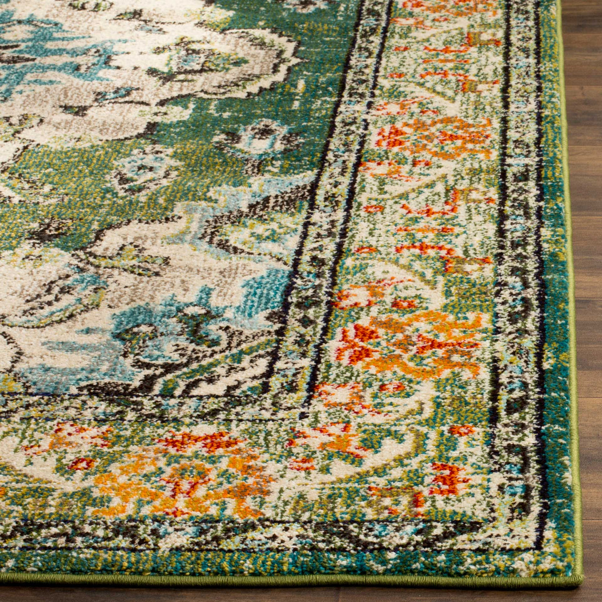 Forest green rug with vivid orange border flowers, a neatly bound edge, and textured pile