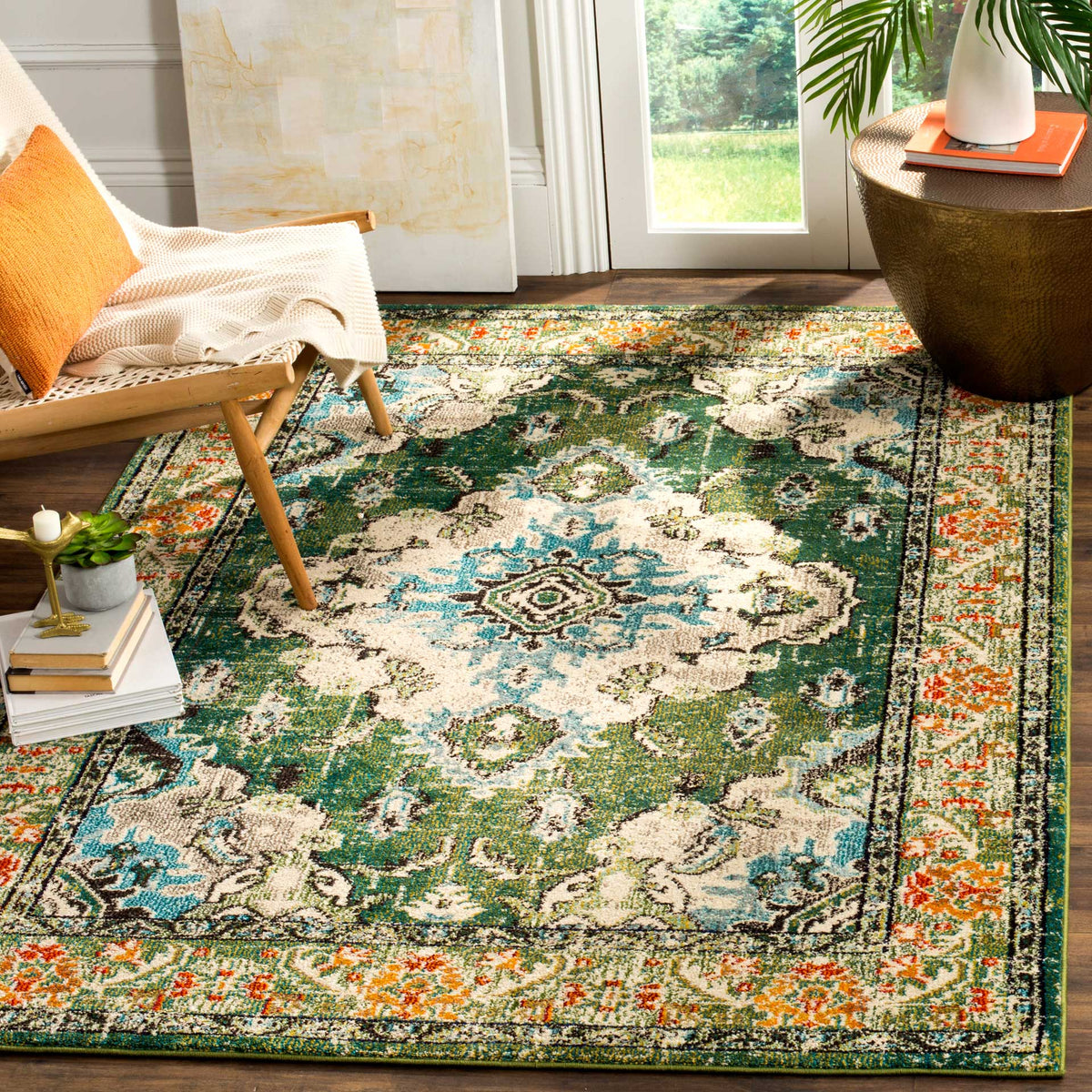 Forest green medallion rug pairs blue and ivory flourishes with warm orange floral borders
