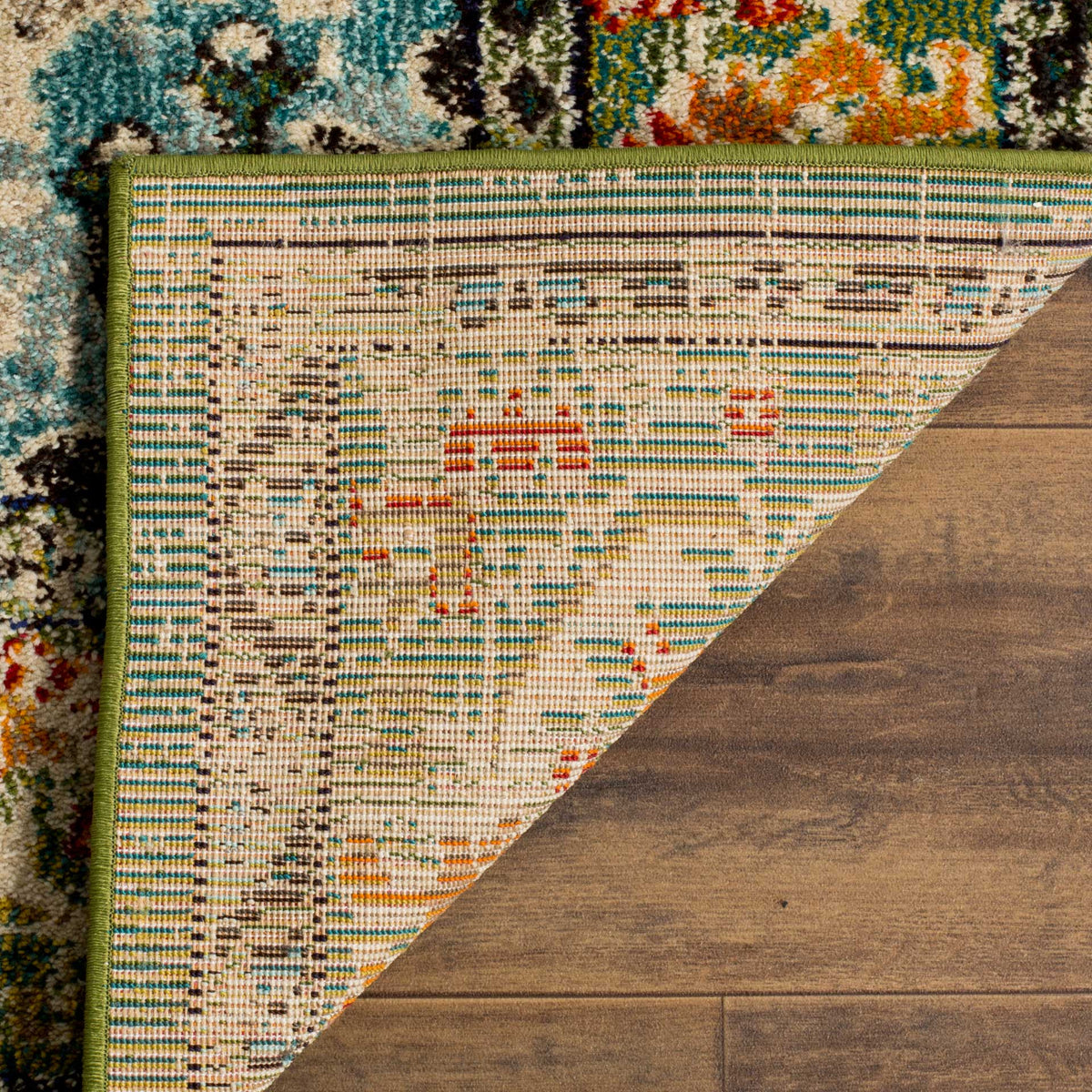Woven cotton backing and green binding support the forest green rug's patterned surface