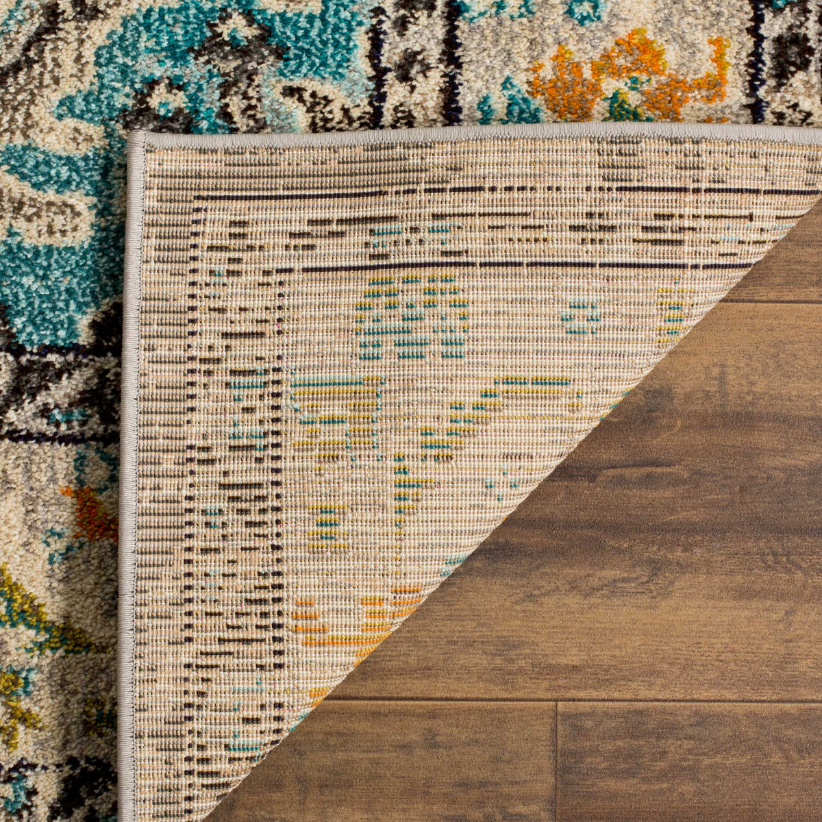 Pastel threads run through the woven cotton backing, finished with a neat gray bound edge