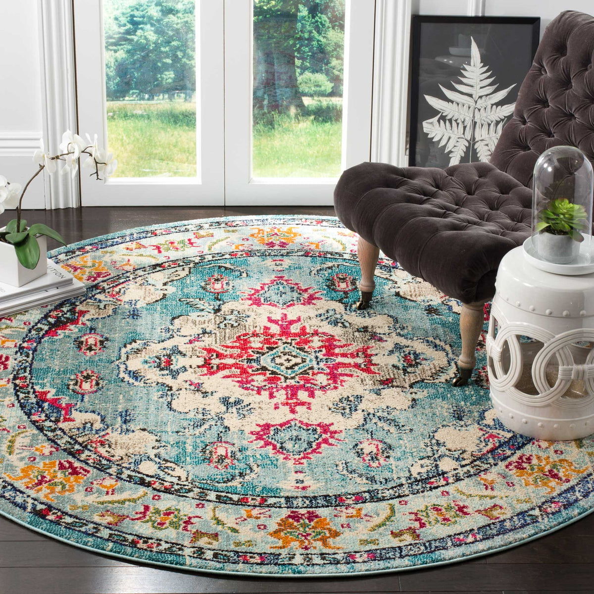 Fuchsia and light blue motifs enliven this round rug's cream medallion and colorful floral border