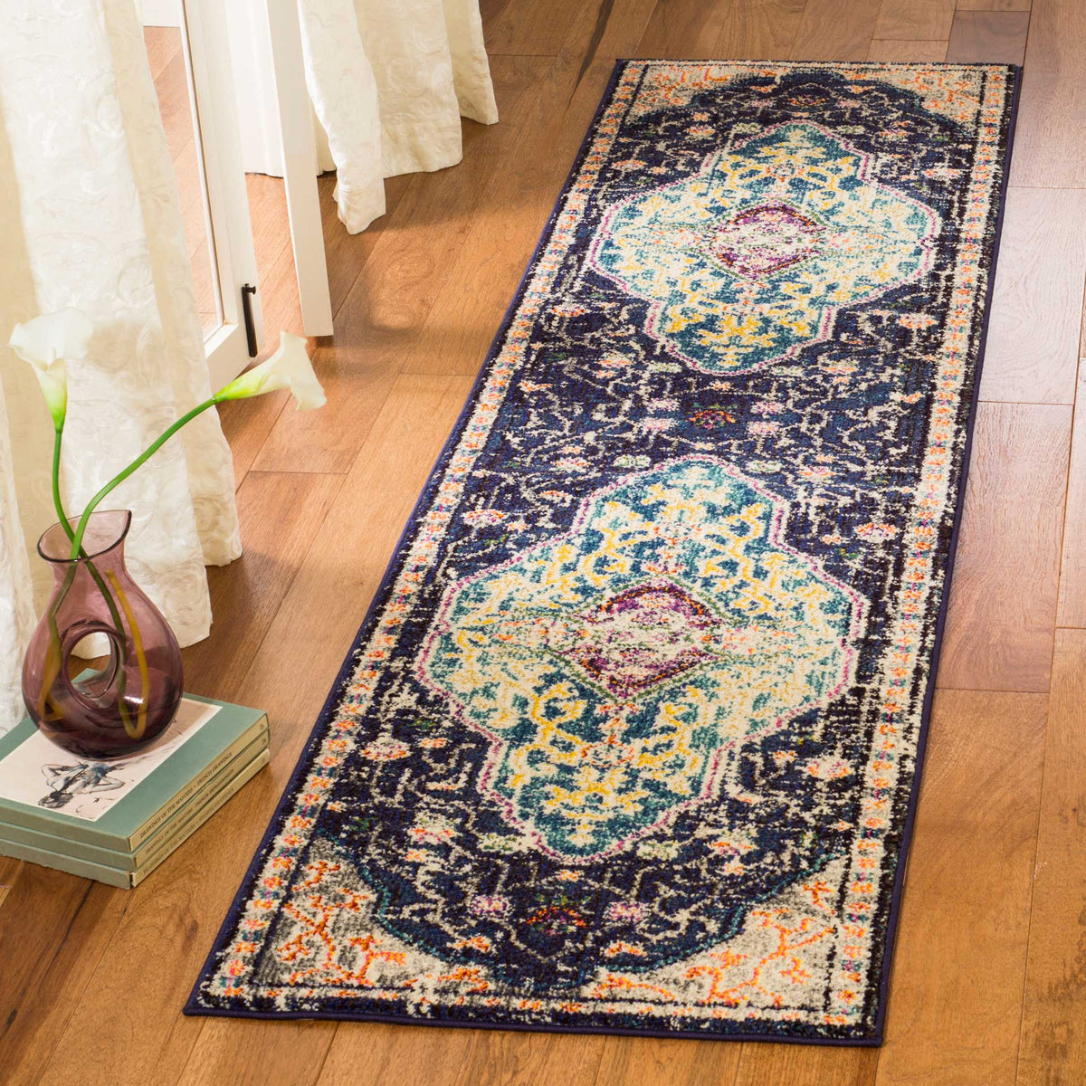 Colorful medallions and an intricate floral border give this runner a traditional feel