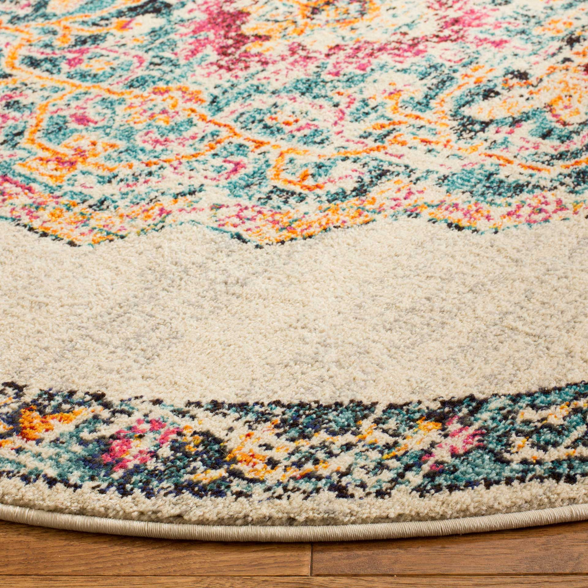 Colorful floral details stand out against a textured cream field, ending in a neatly bound edge.