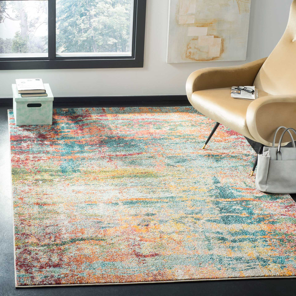 A vivid teal and orange abstract rug adds warmth and color beneath a modern lounge chair