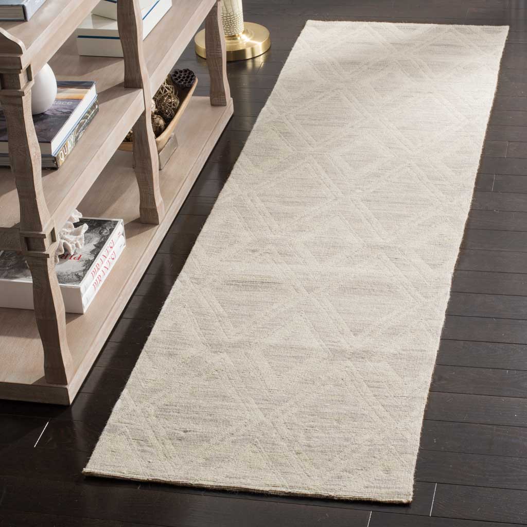 Pale silver and ivory geometric runner softens the look of dark wood flooring