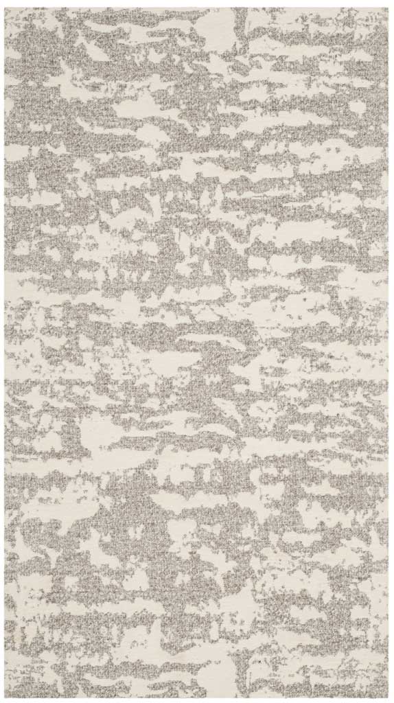A petite light gray and ivory rug brings an airy abstract pattern to smaller spaces.