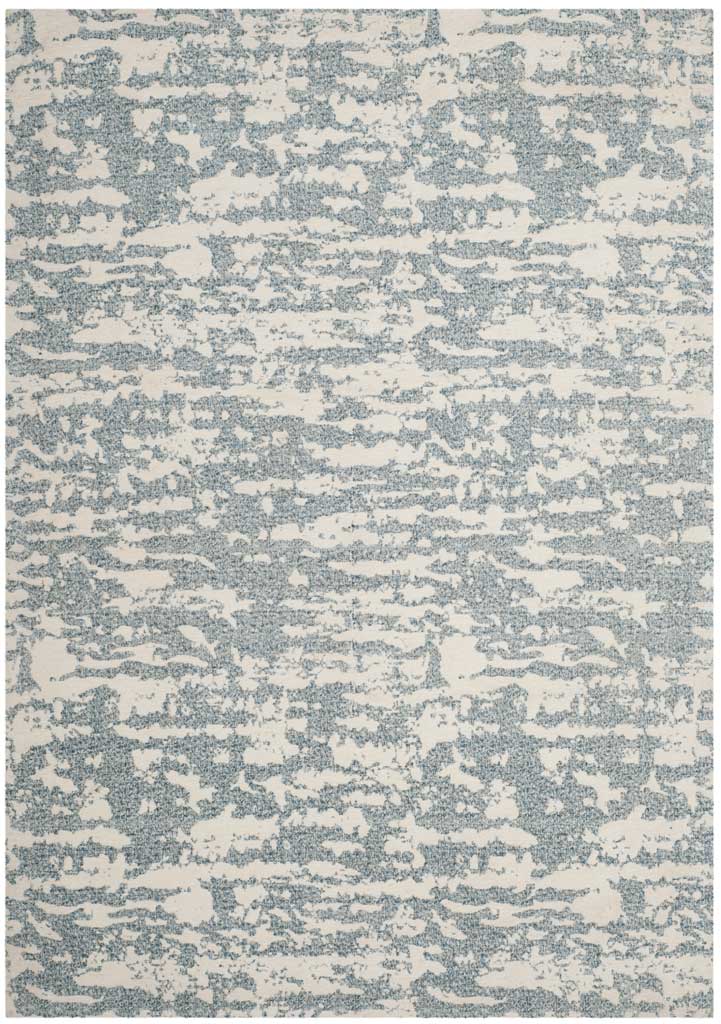 A compact blue and ivory rug adds artistic, textured pattern without overwhelming a room.