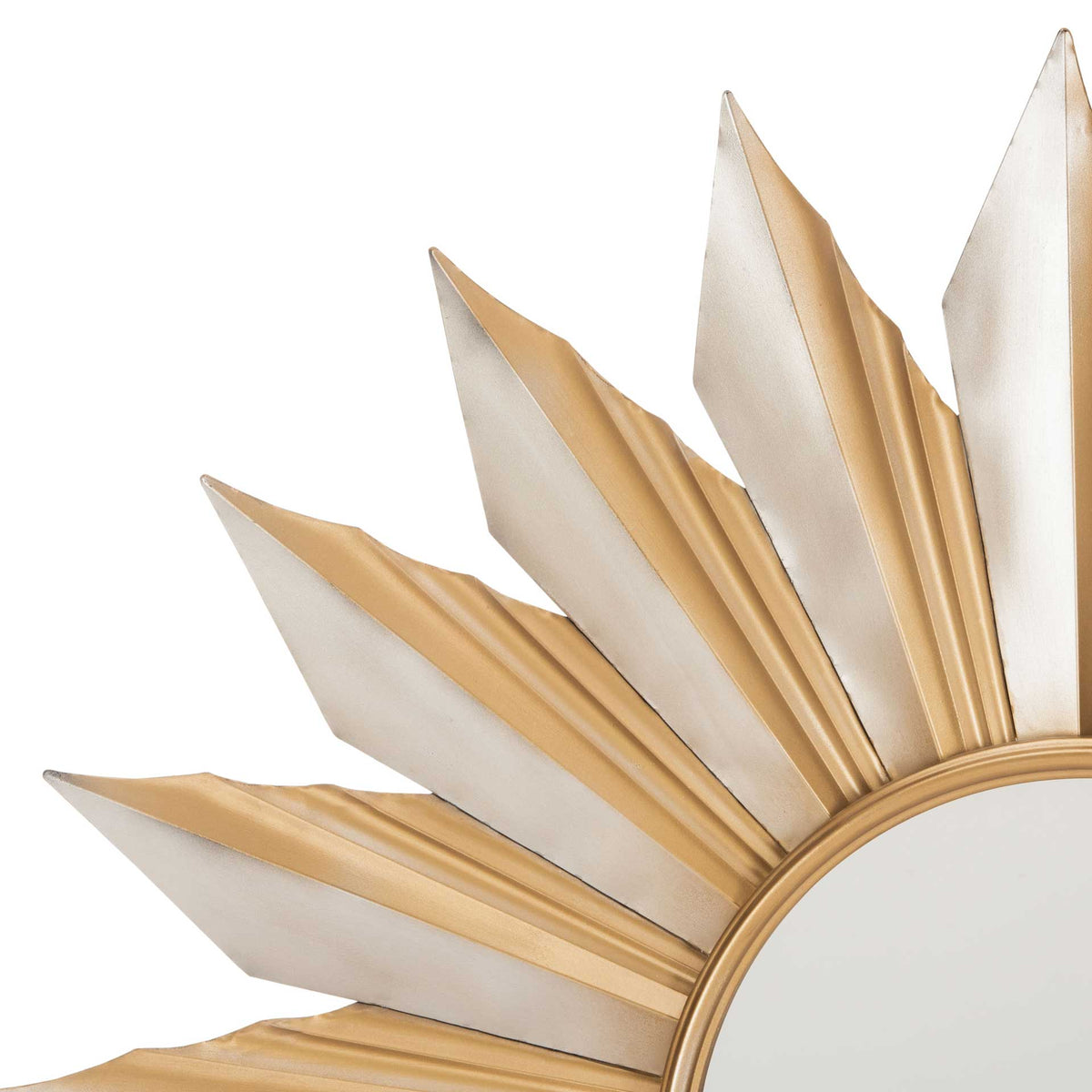 Raised gold ridges and silver-tone points add dimension around the mirror's circular frame
