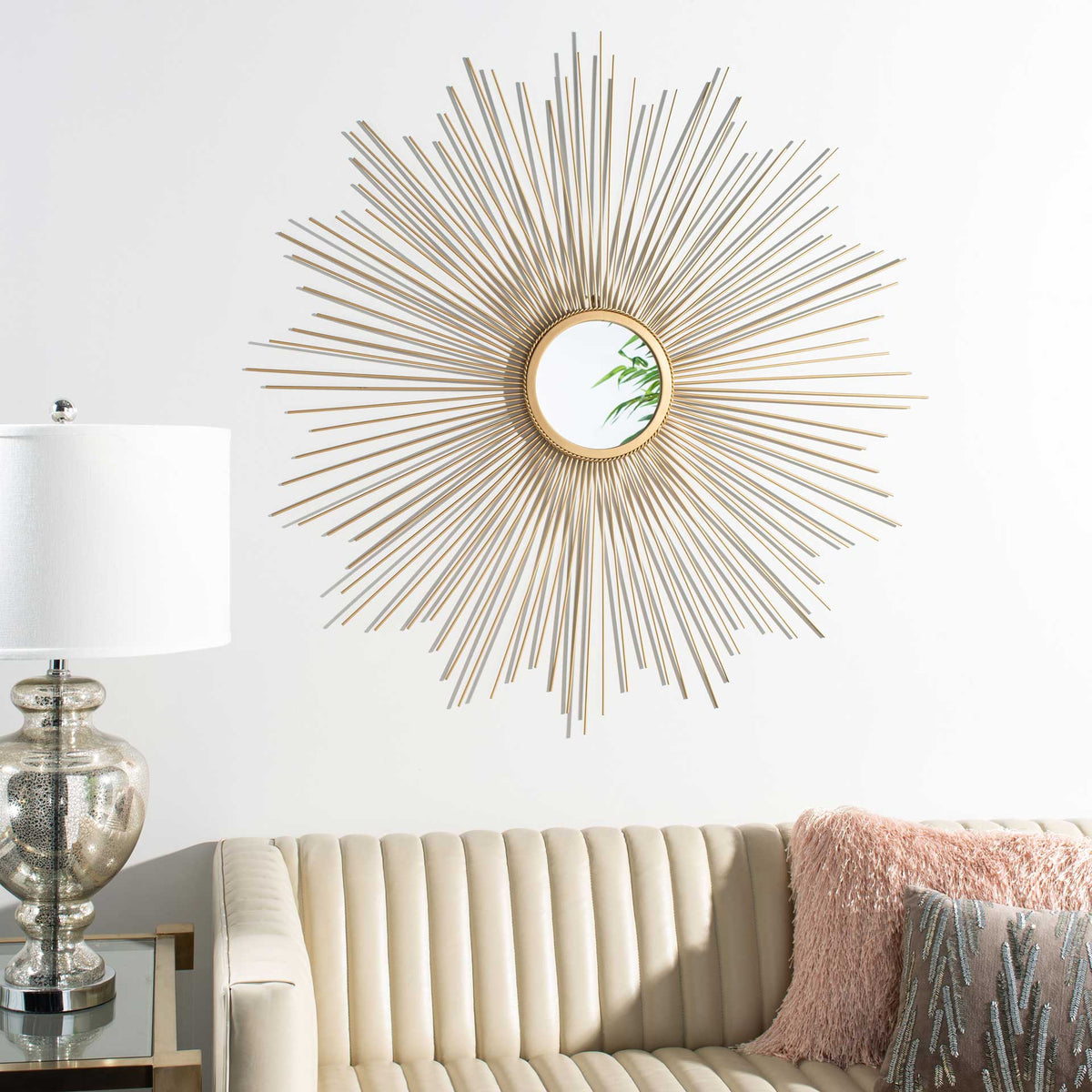 Golden sunburst rays add retro-inspired warmth to the wall above a sofa.