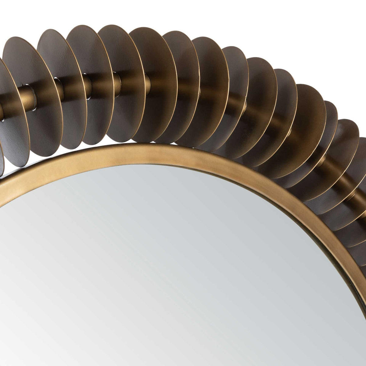 Closely spaced metal discs give the mirror's brass-toned frame a bold, textured edge.