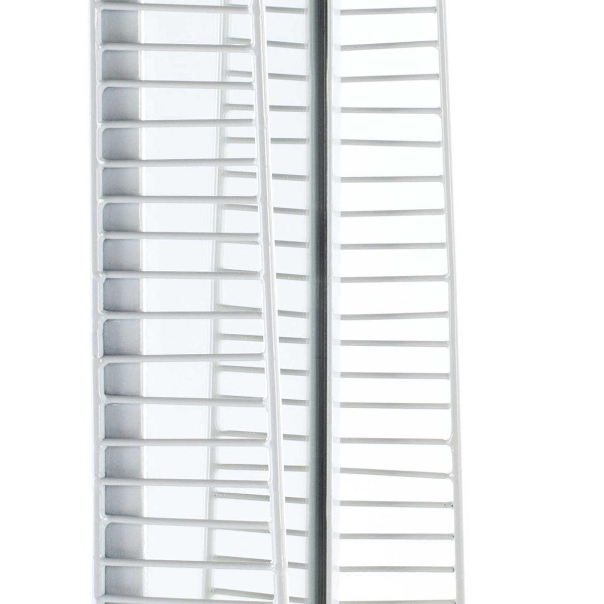 Narrow iron slats create an airy geometric pattern along the mirror's edge