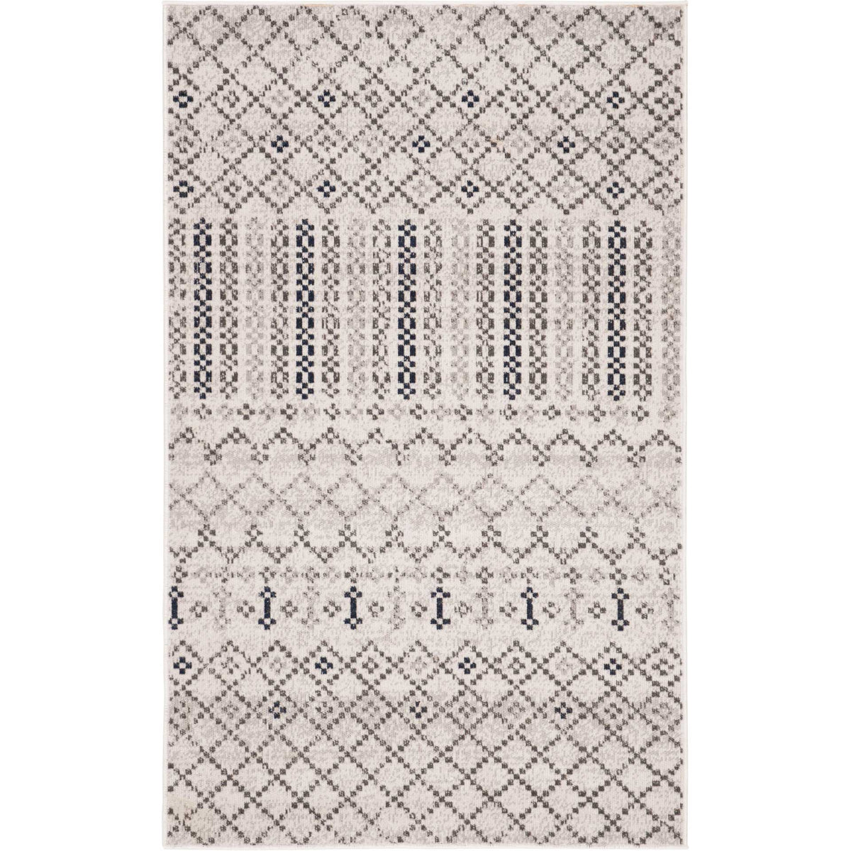 A compact gray rug pairs bold dotted stripes with intricate charcoal diamond motifs.